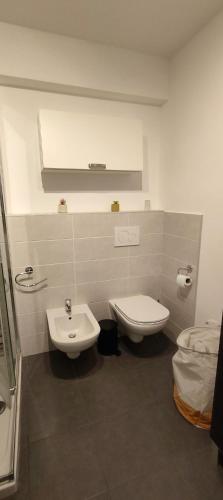 a bathroom with a toilet and a bidet at Piranesi in Menton