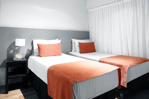 Postel nebo postele na pokoji v ubytování CH Recoleta Suites