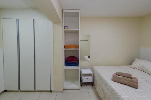 Ένα ή περισσότερα κρεβάτια σε δωμάτιο στο Prime Inn - Guest-House Coração Eucarístico