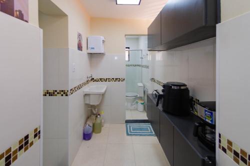 Η κουζίνα ή μικρή κουζίνα στο Prime Inn - Guest-House Coração Eucarístico