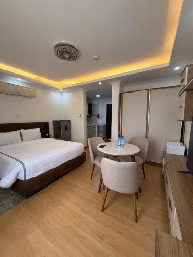 Postel nebo postele na pokoji v ubytování Cascadia Apartments Kigali