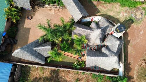 an overhead view of a house with palm trees at Moshi hostel lodge in Msaranga