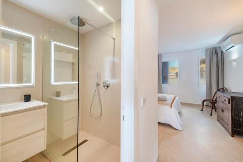 a bathroom with a shower and a sink at Windsong in Port de Pollensa