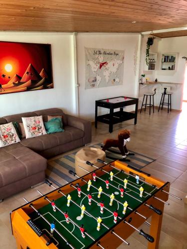 a living room with a foos ball on a table at Casa vacanze Conte in Sannicandro di Bari