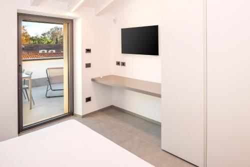 TV a/nebo společenská místnost v ubytování Blumen Apartment