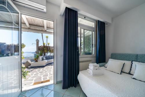 Ένα ή περισσότερα κρεβάτια σε δωμάτιο στο Relais Bijoux Ischia