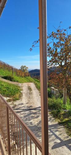 a view from a balcony of a dirt road at Agriturismo La Pina in Tarzo