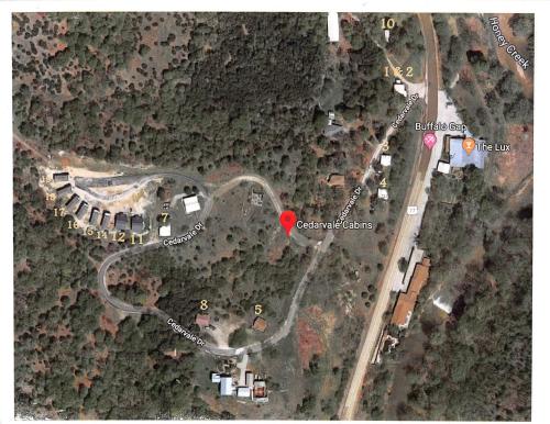 a map of a road with a red heart at Cedarvale Cabins Turner Falls in Davis
