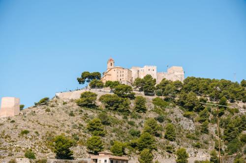 a castle on top of a hill at Moon Dreams Cullera in Cullera