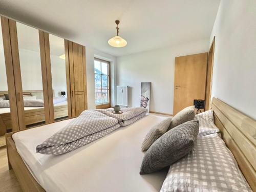 a bedroom with two beds with pillows at Ferienwohnung Johanna in Bad Hindelang