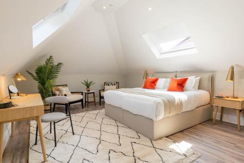 a bedroom with a bed and a table and chairs at Wellington Place I Your Apartment in Bristol