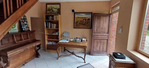 a home office with a desk and a piano at Spacious house in Montignies-sur-Roc with garden in Montignies-sur-Roc