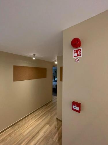 a room with a wall with signs on it at Charming Chalet in Roisin, 400 m² with Terrace in Meaurain