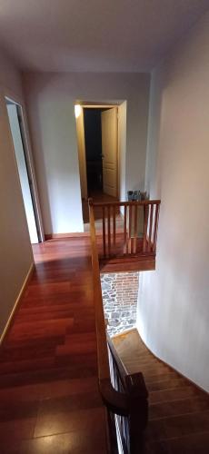a room with a staircase and a stair case at Spacious house in Montignies-sur-Roc with garden in Montignies-sur-Roc