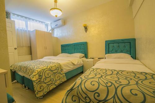 Ένα ή περισσότερα κρεβάτια σε δωμάτιο στο Ancient Town Hotel