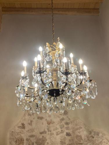 a chandelier hanging from a ceiling at Pedegagia in Vezzano