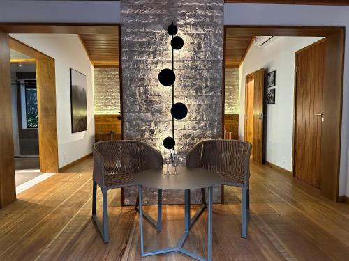a dining room with a table and chairs at Eco Resort Hotel Villa São Romão in Lumiar