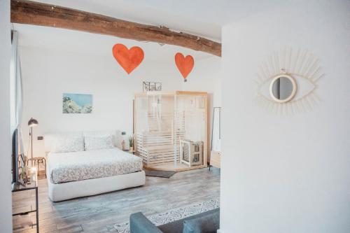 a bedroom with a bed and hearts on the wall at Casa Giulietta Junior20 with private parking in Blevio