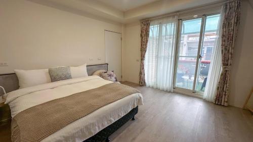 Ένα ή περισσότερα κρεβάτια σε δωμάτιο στο Honey B&B