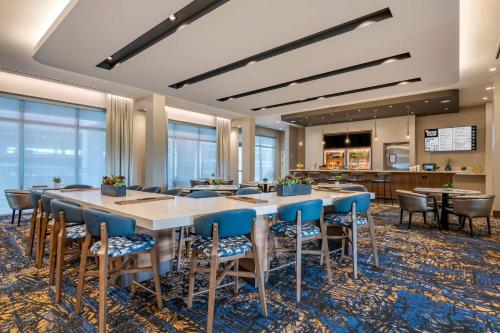 a large dining room with a large table and chairs at Courtyard by Marriott Fort Lauderdale Downtown in Fort Lauderdale