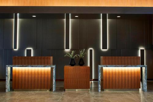 a lobby with two chairs with plants on them at AC Hotel Columbus Dublin in Dublin