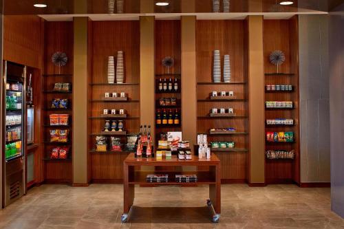 a room with a store with a counter with alcohol at AC Hotel Columbus Dublin in Dublin