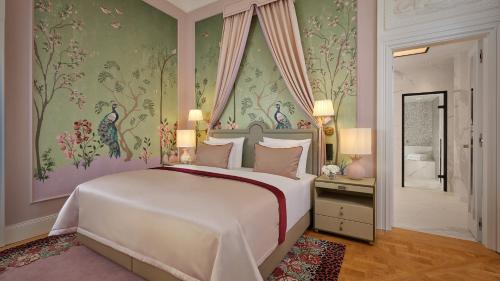 a bedroom with a large white bed in a room at Hotel Taschenbergpalais Kempinski in Dresden