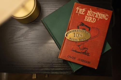a book sitting on top of a table at Garden District Hotel in New Orleans