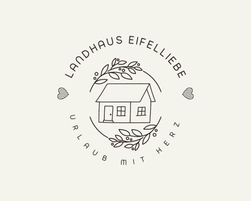a house with areath of flowers and a textromycin elderharmonic efficiency at Landhaus Eifelliebe in Wallersheim