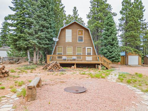 a large house with a porch and a deck at Hillside Hideaway in Duck Creek Village