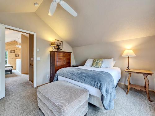 a bedroom with two beds and a table at Hillside Hideaway in Duck Creek Village