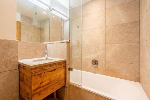 a bathroom with a sink and a shower at Chalet le 4 - Numéro 2 in Le Grand-Bornand