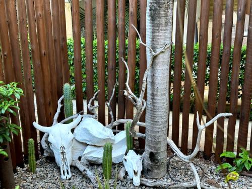 a skeleton of a animal next to a fence at Pousada Oasis Paracuru in Paracuru