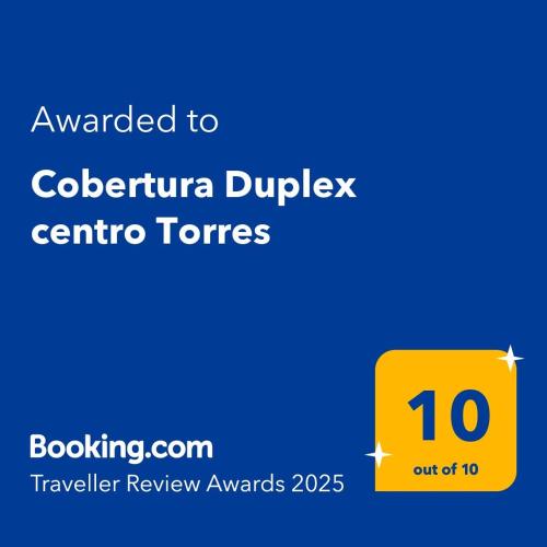 a yellow sign with the text awarded to colombia duplex centre towers at Cobertura Duplex centro Torres in Torres