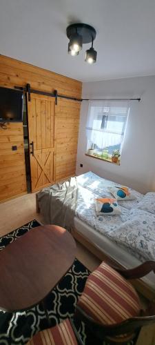 Postel nebo postele na pokoji v ubytování Siedlisko TomaszEwka