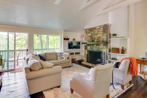 a living room with a couch and a fireplace at High-End Sapphire Retreat on Fairfield Lake! in Sapphire