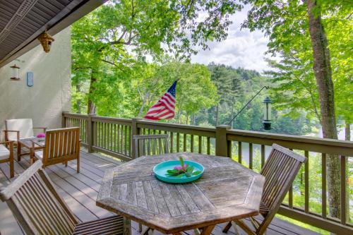 a wooden table on a deck with an american flag at High-End Sapphire Retreat on Fairfield Lake! in Sapphire