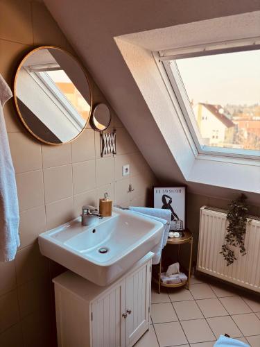 a bathroom with a sink and a mirror at HOTEL ALTES THEATER Heilbronn in Heilbronn