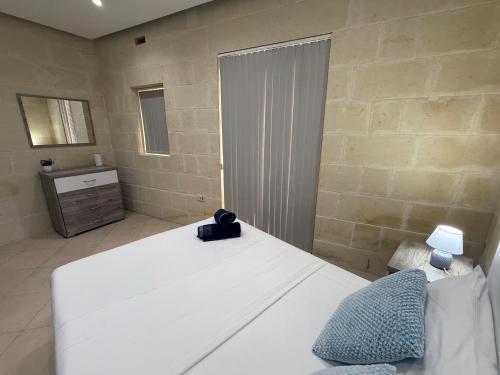 Ένα ή περισσότερα κρεβάτια σε δωμάτιο στο The Nest Siekel Townhouse