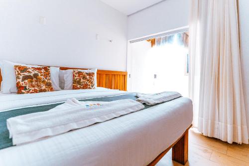 Postel nebo postele na pokoji v ubytování Hotel Casa do Mar