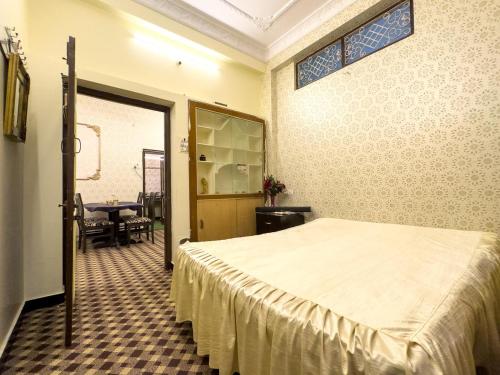 Ένα ή περισσότερα κρεβάτια σε δωμάτιο στο Al Buraq Guest House