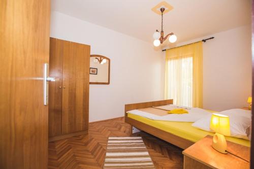 Postel nebo postele na pokoji v ubytování Apartments Renata