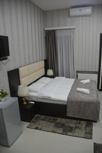 Postel nebo postele na pokoji v ubytování Hotel Care Inn