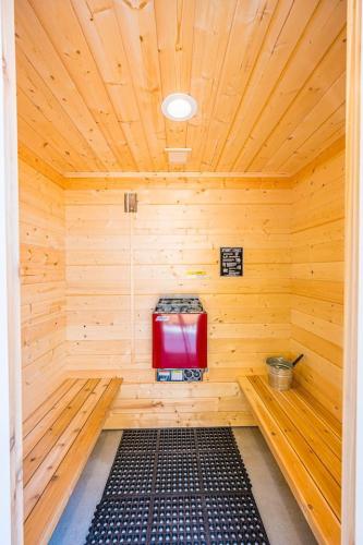 a wooden sauna with a red cooler in it at Grouse in Law Hikers Paradise in Port Angeles