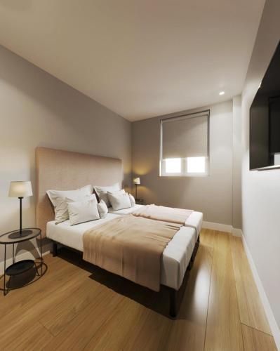 Ένα ή περισσότερα κρεβάτια σε δωμάτιο στο Apartamentos Ovetum
