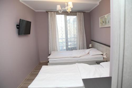 Postel nebo postele na pokoji v ubytování Apartment Retro