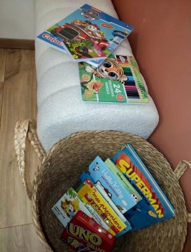 a basket filled with toothbrushes and toothpaste at Maison RoMa, se ressourcer proche de Gerardmer et La Bresse in Vagney