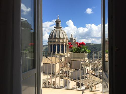 a view of a building from a window at Il Duomo Relais in Ragusa