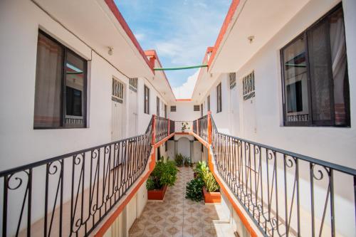a hallway of a building with a balcony at Arena Surf Hotel, Puerto Escondido in Puerto Escondido
