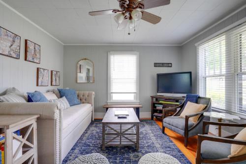 a living room with a couch and a tv at Carousel Cottage North Chattanooga Home! in Chattanooga